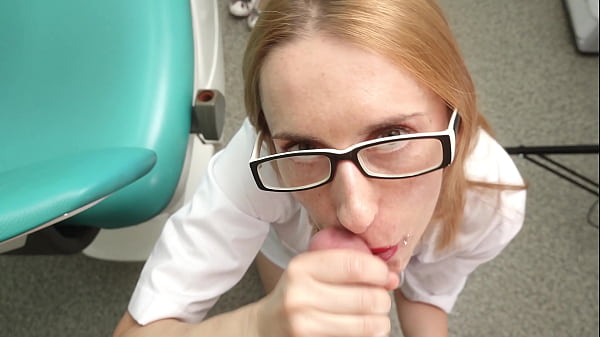Ukrainian doctor with glasses gets on knees and sucks the patient’s cock, spraying cum on her face and cumming in her mouth. The doctor licks up the drops of cum